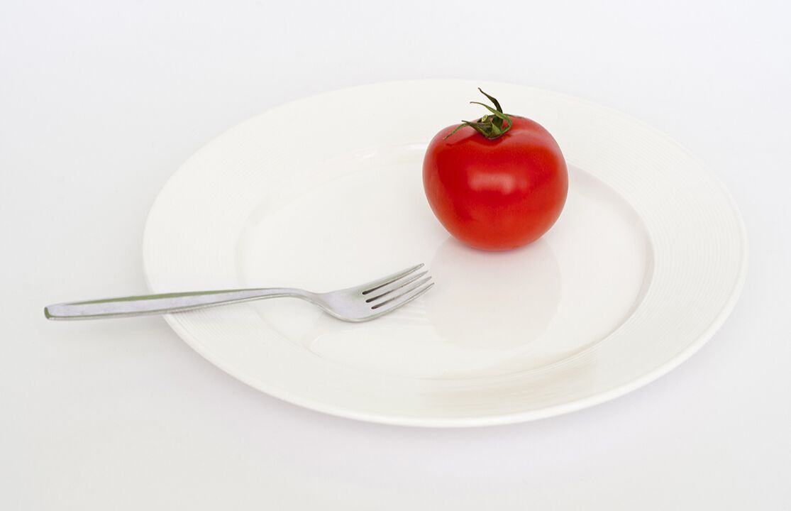 tomatoes with a fork on a plate